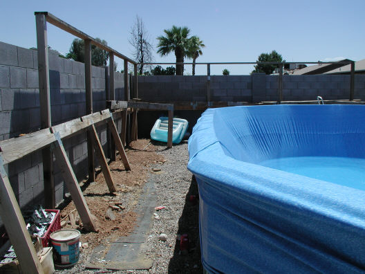 deck removed from above ground pool to install liner
