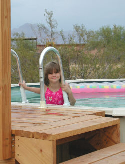child in an above ground pool