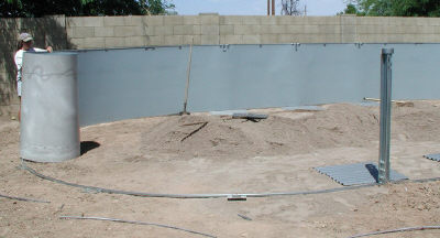 installing pool wall around sand