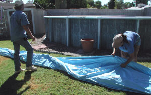 laying out the pool liner