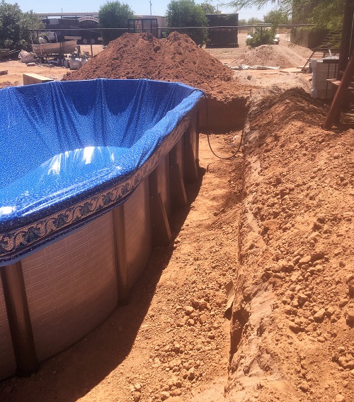 above ground pool in a large hole