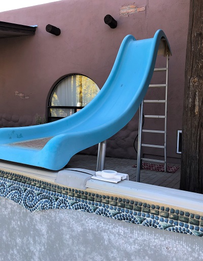 Pool Slide next to above ground pool