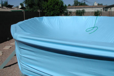 expandable liner pulled over pool rails