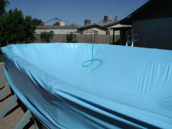 stretching above ground pool liner